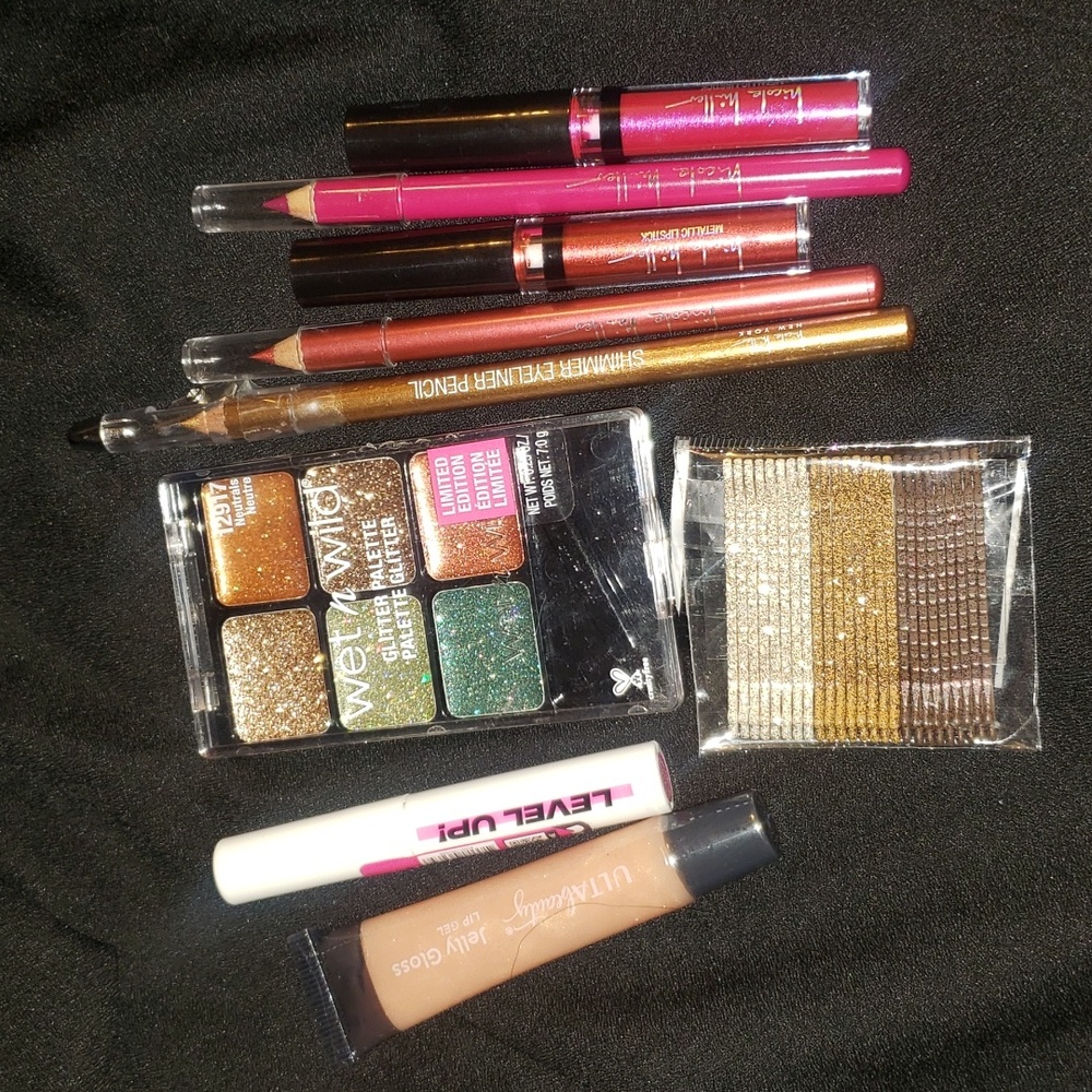 Makeup lot 9 glitter shimmer eyeshadow, eye liner, Lipstick, mascara, hair pins.